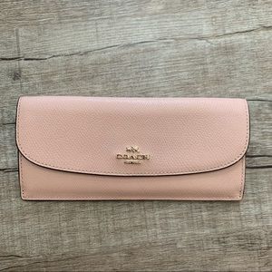 Gently used Coach wallet in light pink